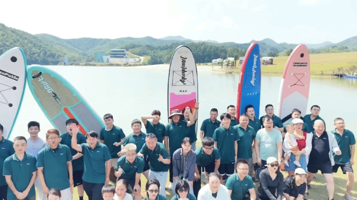 Shanghai Duomu employees kayaking together at Anlan Lake in Anji