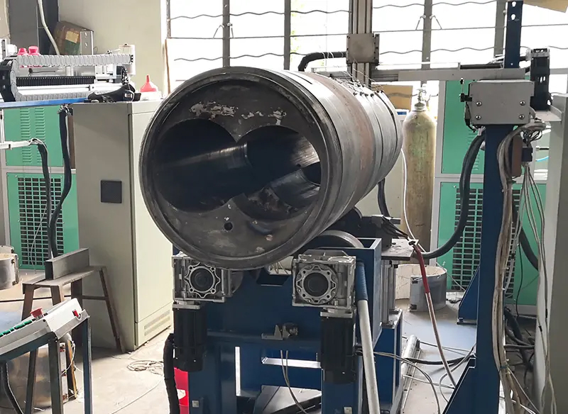  Internal bore of an extruder barrel being measured before repair