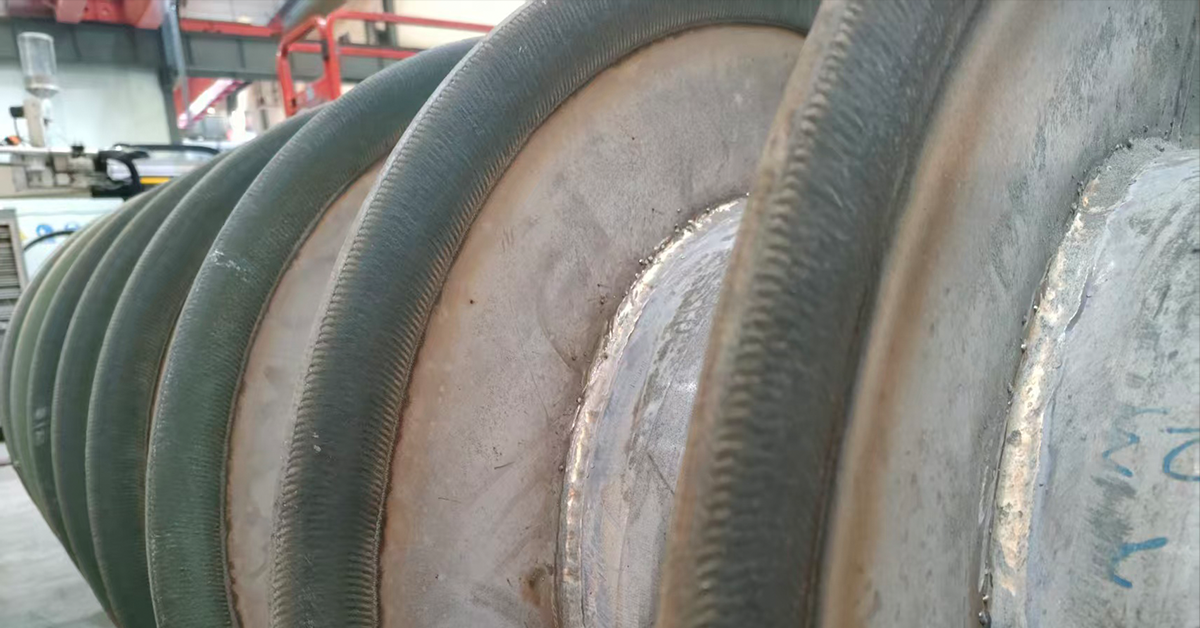 Remanufactured screw conveyor after PTA welding refurbishment
