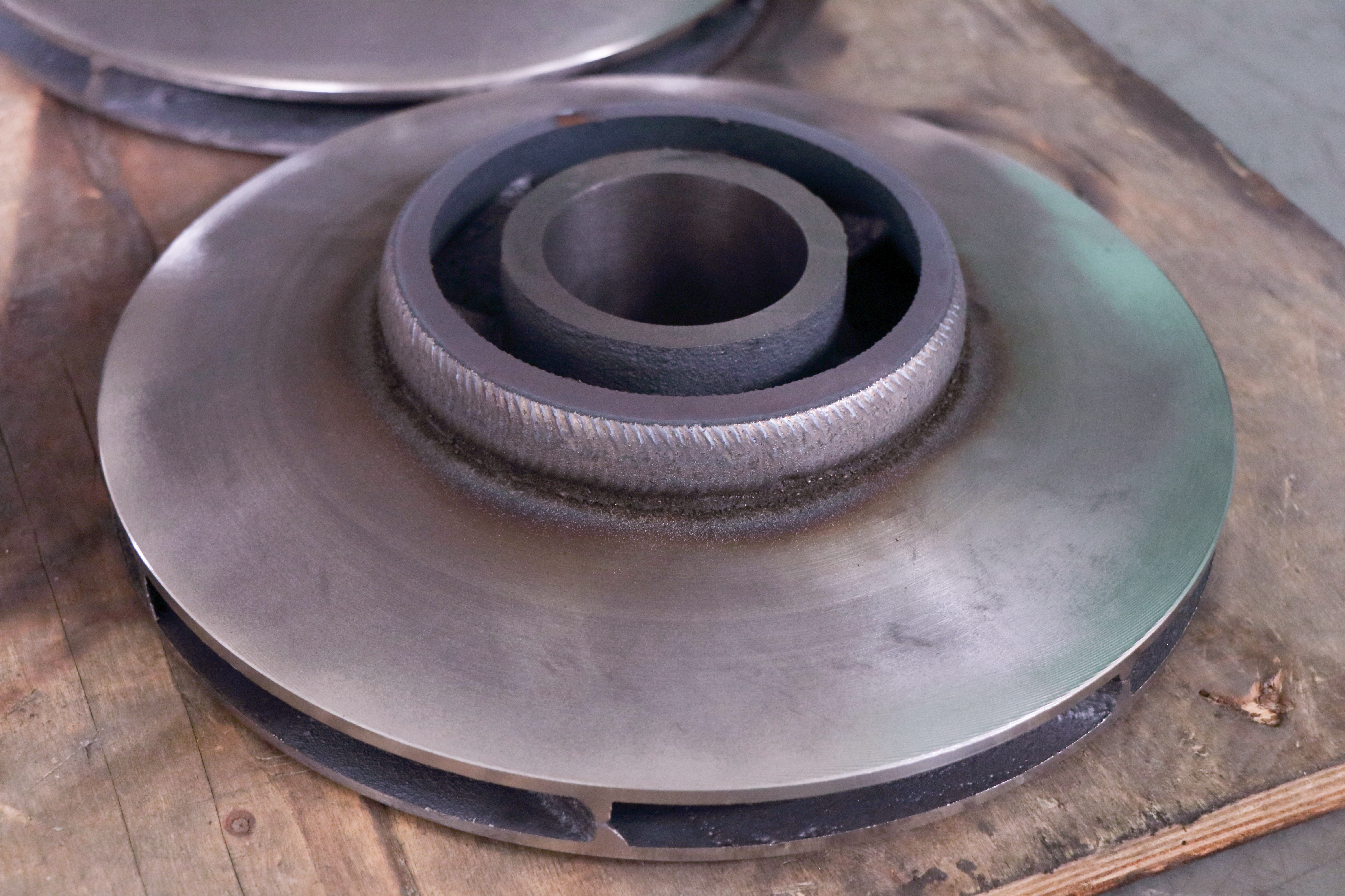 Repaired pump impeller with PTA hardfacing coating